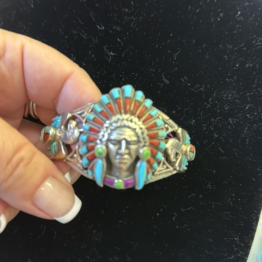 Inlay chief sterling cuff with thunderbird and sunface on the side.